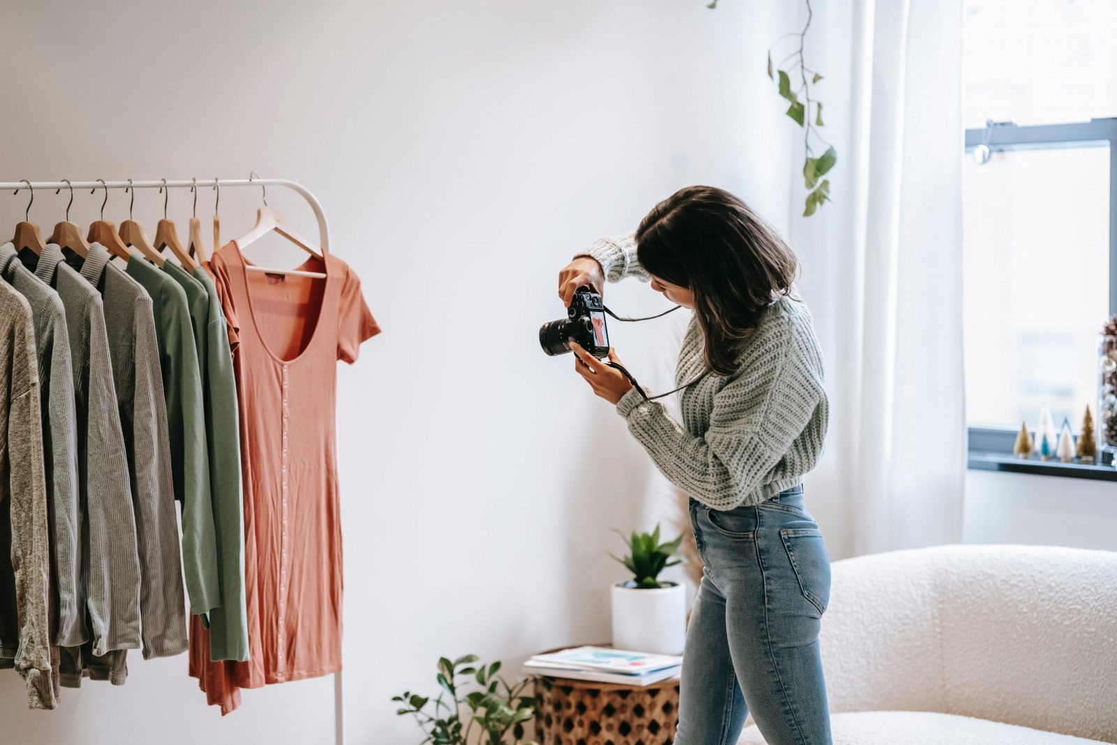 Fashion entrepreneur taking product images and videos in a fashion studio.