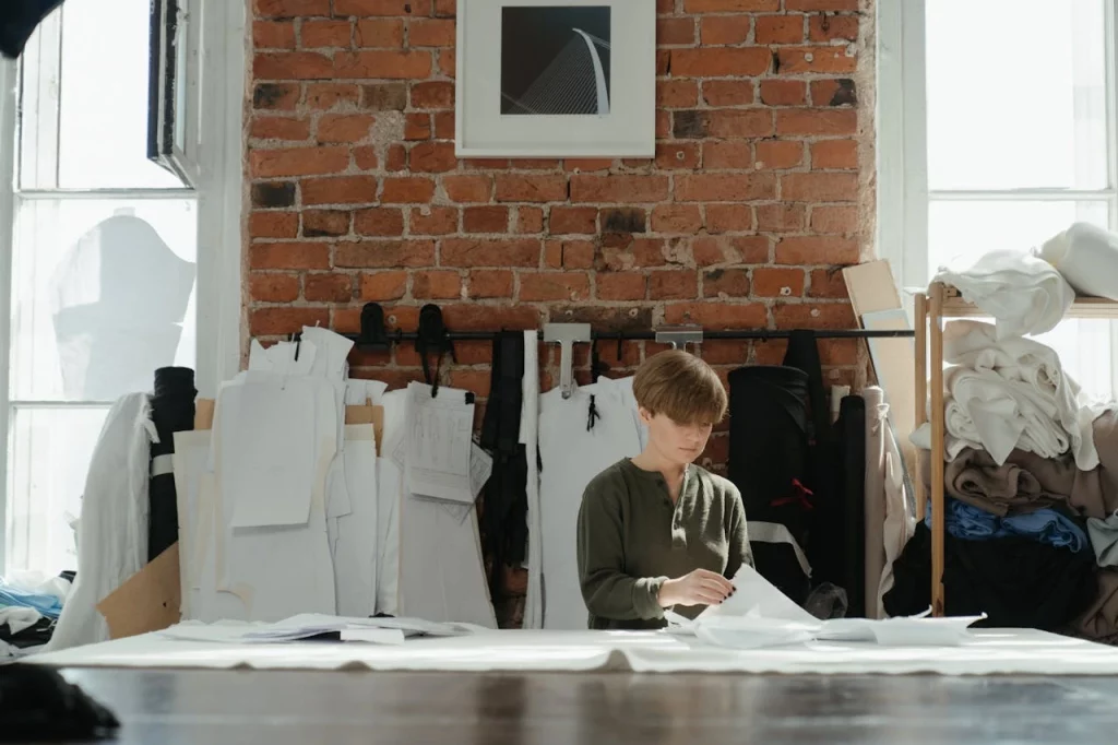 Lady in a garment workshop working on a design Efficiency Process setup by woman in a factory of garments