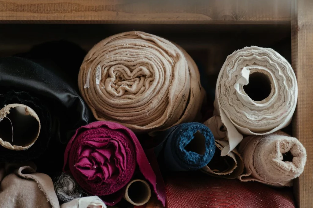 sustainable process of building fashionable clothes, rolls of fabric kept on each other