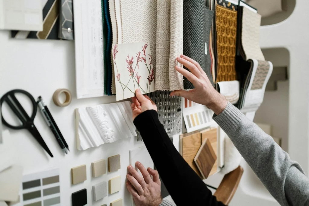 the myth of sustainable fashion by selecting organic material and cloths kept on a table and being selected by two individual hands