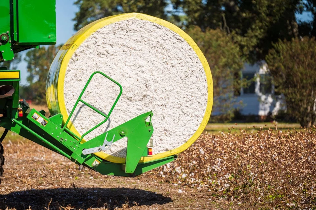 Yushkova Designs Farming cotton roll and kept on a heavy machinery which will create sustainable cotton fabric